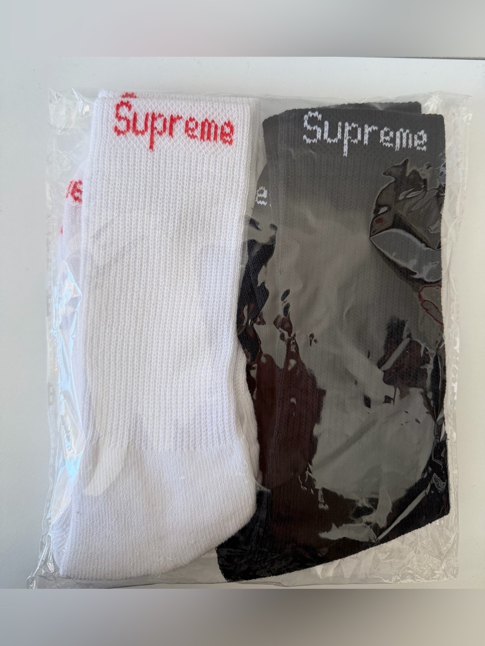 Supreme socks 2 pair one white one black FAST SHIPPINF